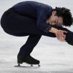 
              Yuma Kagiyama, of Japan, competes during the men's short program figure skating competition at the 2022 Winter Olympics, Tuesday, Feb. 8, 2022, in Beijing. (AP Photo/Bernat Armangue)
            