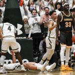 
              Wyoming's Graham Ike (33) reacts after being called for a foul on Colorado State's David Roddy, lying on court, during the first half of an NCAA college basketball game Wednesday, Feb. 23, 2022, in Fort Collins, Colo. (AAron Ontiveroz/The Denver Post via AP)
            