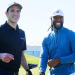 
              Former Arizona Cardinals NFL football wide receiver Larry Fitzgerald, right, laughs with WHOOP CEO Will Ahmed, left, as they wait at the 10th hole during the Pro-Am at the Phoenix Open golf tournament Wednesday, Feb. 9, 2022, in Scottsdale, Ariz. (AP Photo/Ross D. Franklin)
            