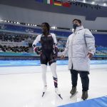 
              Erin Jackson of the United States reacts with her coach Ryan Shimabukuro after winning her heat in the speedskating women's 500-meter race at the 2022 Winter Olympics, Sunday, Feb. 13, 2022, in Beijing. (AP Photo/Ashley Landis)
            
