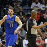 
              Dallas Mavericks guard Luka Doncic (77) points to the crowd after a score during the second half of an NBA basketball game against the New Orleans Pelicans in New Orleans, Thursday, Feb. 17, 2022. (AP Photo/Matthew Hinton)
            