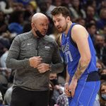 
              Dallas Mavericks guard Luka Doncic (77) holds his finger as he talks to head coach Jason Kidd during the first half of an NBA basketball game against the Detroit Pistons in Dallas, Tuesday, Feb. 8, 2022. (AP Photo/LM Otero)
            