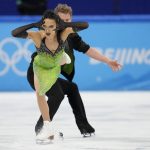 
              Madison Chock and Evan Bates, of the United States, perform their routine in the ice dance competition during figure skating at the 2022 Winter Olympics, Saturday, Feb. 12, 2022, in Beijing. (AP Photo/Natacha Pisarenko)
            