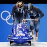 
              Elana Meyers Taylor and Sylvia Hoffman, of the United States, start the women's bobsleigh heat 1 at the 2022 Winter Olympics, Friday, Feb. 18, 2022, in the Yanqing district of Beijing. (AP Photo/Mark Schiefelbein)
            