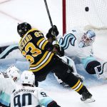 
              Seattle Kraken goaltender Chris Driedger makes a save on a shot by Boston Bruins left wing Brad Marchand (63) during the first period of an NHL hockey game, Tuesday, Feb. 1, 2022, in Boston. (AP Photo/Charles Krupa)
            