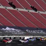 
              Competitors race around the track during a practice session at the Los Angeles Memorial Coliseum, Saturday, Feb. 5, 2022, in Los Angeles, ahead of a NASCAR exhibition auto race. (AP Photo/Marcio Jose Sanchez)
            