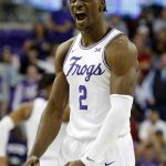 
              TCU forward Emanuel Miller (2) flexes on the court after a shot against Iowa State during the second half of an NCAA basketball game Tuesday, Feb. 15, 2022, in Fort Worth, Texas. (AP Photo/Richard W. Rodriguez)
            