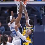 
              Orlando Magic center Wendell Carter Jr. (34) and Indiana Pacers forward Torrey Craig (13) vie for a rebound during the second half of an NBA basketball game in Indianapolis, Wednesday, Feb. 2, 2022. (AP Photo/Doug McSchooler)
            