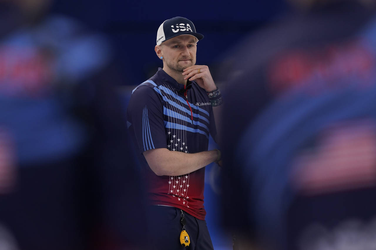 United States' Colin Hufman waits to compete during a men's curling match against Canada at the Bei...