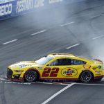 
              Joey Logano does a burnout at the start/finish line after winning a NASCAR exhibition auto race at Los Angeles Memorial Coliseum, Sunday, Feb. 6, 2022, in Los Angeles. (AP Photo/Marcio Jose Sanchez)
            