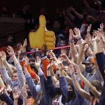 
              Virginia fans hold up signs during an NCAA college basketball game against Georgia Tech in Charlottesville, Va., Saturday, Feb. 12, 2022. (AP Photo/Andrew Shurtleff)
            