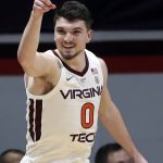 
              Virginia Tech's Hunter Cattoor (0) celebrates scoring a 3-point basket off an assist in the first half of an NCAA college basketball game against Pittsburgh in Blacksburg, Va., Monday, Feb. 7 2022. (Matt Gentry/The Roanoke Times via AP)
            