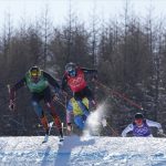 
              Switzerland's Ryan Regez leads the pack, followed by Switzerland's Alex Fiva, Sergey Ridzik, of the Russian Olympic Committee, and Sweden's Erik Mobaerg, during the men's cross finals at the 2022 Winter Olympics, Friday, Feb. 18, 2022, in Zhangjiakou, China. (AP Photo/Gregory Bull)
            