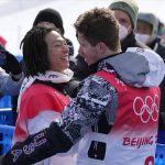 
              Gold medal winner Japan's Ayumu Hirano, left, gets congratulated by United States' Shaun White after the men's halfpipe finals at the 2022 Winter Olympics, Friday, Feb. 11, 2022, in Zhangjiakou, China. (AP Photo/Lee Jin-man)
            