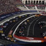 
              Competitors make a turn during a NASCAR exhibition auto race at Los Angeles Memorial Coliseum, Sunday, Feb. 6, 2022, in Los Angeles. (AP Photo/Marcio Jose Sanchez)
            