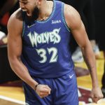 
              Minnesota Timberwolves' Karl-Anthony Towns celebrates after making a shot during the three-point shot skills challenge competition, part of NBA All-Star basketball game weekend, Saturday, Feb. 19, 2022, in Cleveland. (AP Photo/Ron Schwane)
            