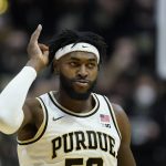 
              Purdue forward Trevion Williams (50) reacts after hitting a shot during the first half of an NCAA college basketball game against Michigan, Saturday, Feb. 5, 2022, in West Lafayette, Ind. (AP Photo/Darron Cummings)
            
