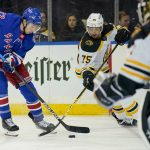 
              New York Rangers center Filip Chytil (72) and Boston Bruins defenseman Connor Clifton (75) battle for the puck in the second period of an NHL hockey game, Tuesday, Feb. 15, 2022, in New York. (AP Photo/John Minchillo)
            