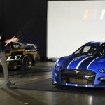 
              FILE  Driver Joey Lagano talks about the Next Gen Mustang Cup car that will be used starting in the 2022 season during a NASCAR media event in Charlotte, N.C., Wednesday, May 5, 2021. The overdue Next Gen car has at last arrived following a one-year pandemic delay. The spec car is a collaboration between all of NASCAR's stakeholders and that includes the drivers. (AP Photo/Mike McCarn, File)
            
