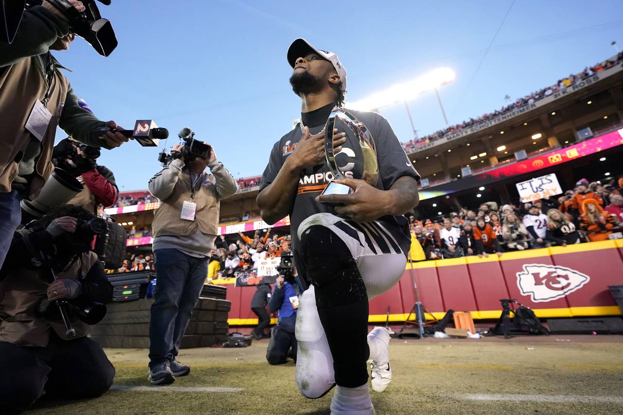 Cincinnati Bengals running back Joe Mixon holds the Lamar Hunt trophy after  the AFC championship NFL football game against the Kansas City Chiefs,  Sunday, Jan. 30, 2022, in Kansas City, Mo. The