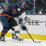 
              San Jose Sharks center Logan Couture, right, looks for the puck as Edmonton Oilers defenseman Cody Ceci (5) defends during the first period of an NHL hockey game in San Jose, Calif., Monday, Feb. 14, 2022. (AP Photo/Jeff Chiu)
            