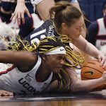 
              Connecticut's Aaliyah Edwards and Villanova's Lior Garzon (12) dive for the ball in the second half of an NCAA college basketball game, Wednesday, Feb. 9, 2022, in Hartford, Conn. (AP Photo/Jessica Hill)
            