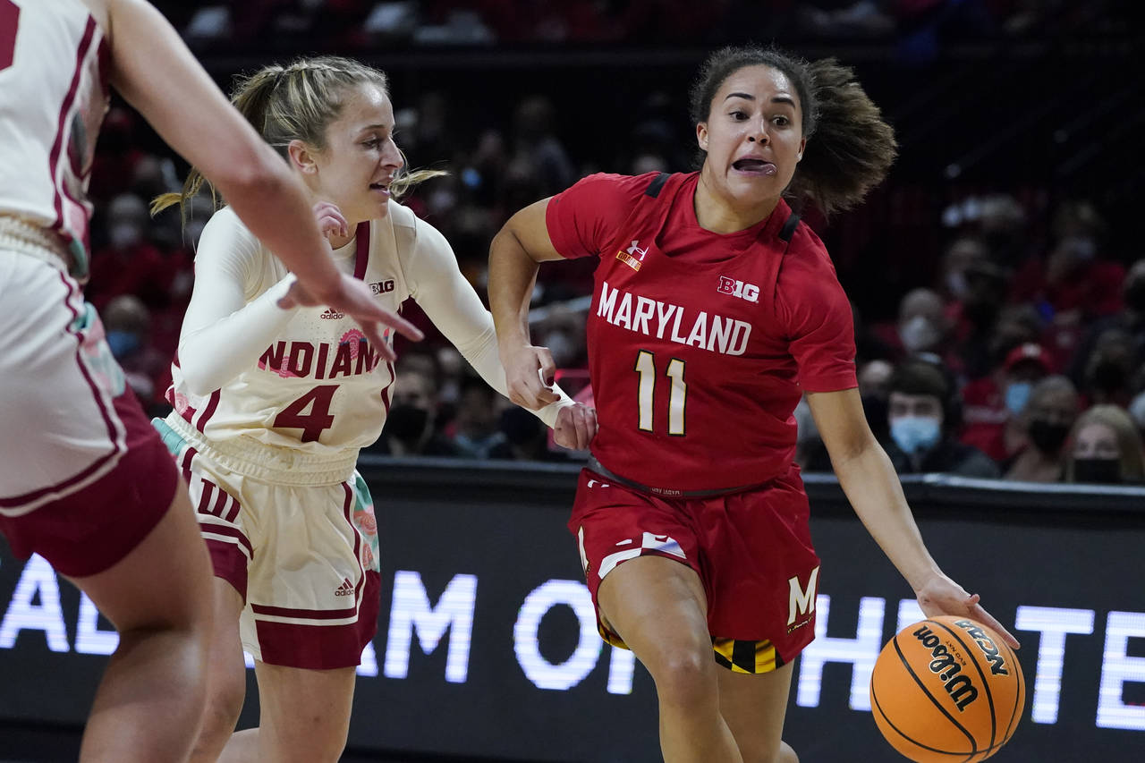 Maryland guard Katie Benzan (11) drives to the basket against Indiana guard Nicole Cardano-Hillary ...