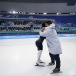 
              Erin Jackson of the United States hugs coach Ryan Shimabukuro after winning the gold medal in the speedskating women's 500-meter race at the 2022 Winter Olympics, Sunday, Feb. 13, 2022, in Beijing. (AP Photo/Ashley Landis)
            