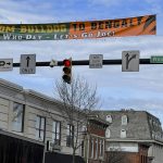 
              A banner stretched across Court Street in uptown Athens, Ohio, recognizes Joe Burrow's ascension from Athens High School star to Super Bowl quarterback for the Cincinnati Bengals, Wednesday, Feb. 9, 2022. Burrow, who grew up in the nearby village of The Plains, will lead the Bengals against the Los Angeles Rams in the Super Bowl on Sunday. (AP Photo/Mitch Stacy)
            
