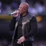 
              Dr. Dre performs during halftime of the NFL Super Bowl 56 football game between the Los Angeles Rams and the Cincinnati Bengals Sunday, Feb. 13, 2022, in Inglewood, Calif. (AP Photo/Lynne Sladky)
            
