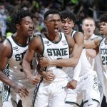 
              Michigan State's Tyson Walker, center, Julius Marble, left, and Max Christie, right, celebrate during the final seconds of the second half of an NCAA college basketball game against Purdue, Saturday, Feb. 26, 2022, in East Lansing, Mich. Michigan State won 68-65. (AP Photo/Al Goldis)
            