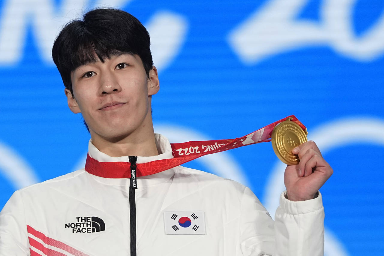 Gold medalist Hwang Dae-heon of South Korea celebrates during the medal ceremony for the men's 1500...