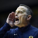 
              Murray State head coach Matt McMahon shouts instructions to his team during the second half of an NCAA college basketball game against Austin Peay in Murray, Ky., Thursday, Feb. 17, 2022. (AP Photo/Timothy D. Easley)
            