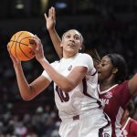 
              South Carolina center Kamilla Cardoso (10) drives to the hoop against Alabama center Jada Rice, right, during the first half of an NCAA college basketball game Thursday, Feb. 3, 2022, in Columbia, S.C. (AP Photo/Sean Rayford)
            