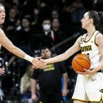 
              Iowa guard Caitlin Clark, right, gets a high-five from center Monika Czinano during the team's NCAA college basketball game against Iowa on Wednesday, Feb. 9, 2022, in Iowa City, Iowa. (Joesph Cress/Iowa City Press-Citizen via AP)
            