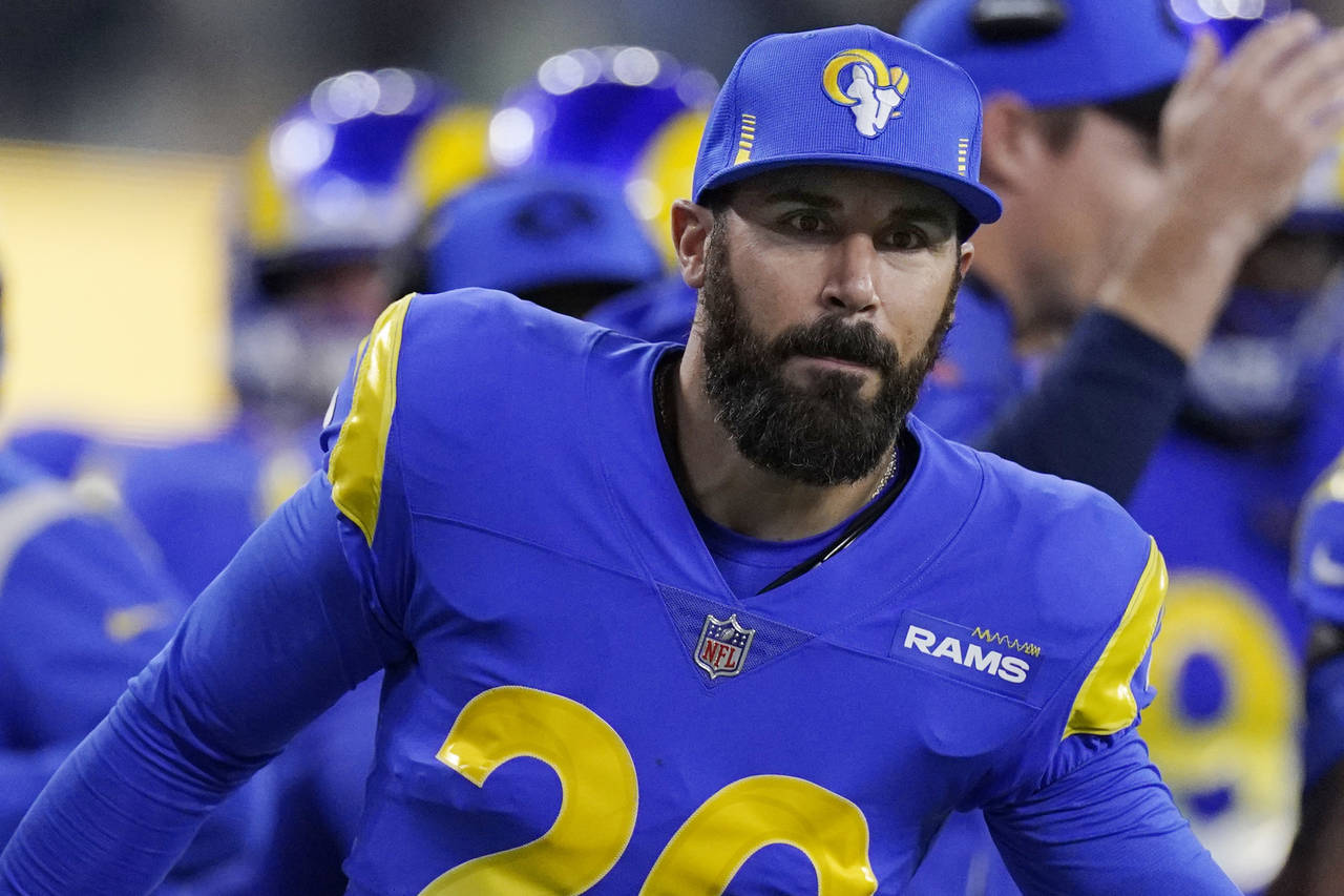 FILE - Los Angeles Rams defensive back Eric Weddle (20) congratulates teammates during the second h...