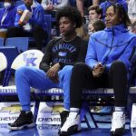
              Injured Kentucky guards Sahvir Wheeler, left, and Tyty Washington Jr. sit on the bench while the team huddles before the second half of an NCAA college basketball game against LSU in Lexington, Ky., Wednesday, Feb. 23, 2022. (AP Photo/James Crisp)
            