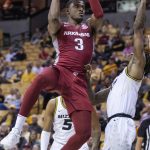 
              Arkansas' Trey Wade, left, shoots over Missouri's DaJuan Gordon during the first half of an NCAA college basketball game Tuesday, Feb. 15, 2022, in Columbia, Mo. (AP Photo/L.G. Patterson)
            