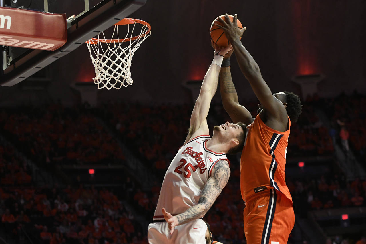 Ohio State's Kyle Young (25) vies for a rebound against Illinois' Kofi Cockburn during the first ha...