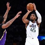 
              Utah Jazz guard Donovan Mitchell, right, shoots as Los Angeles Lakers forward Anthony Davis defends during the first half of an NBA basketball game Wednesday, Feb. 16, 2022, in Los Angeles. (AP Photo/Mark J. Terrill)
            