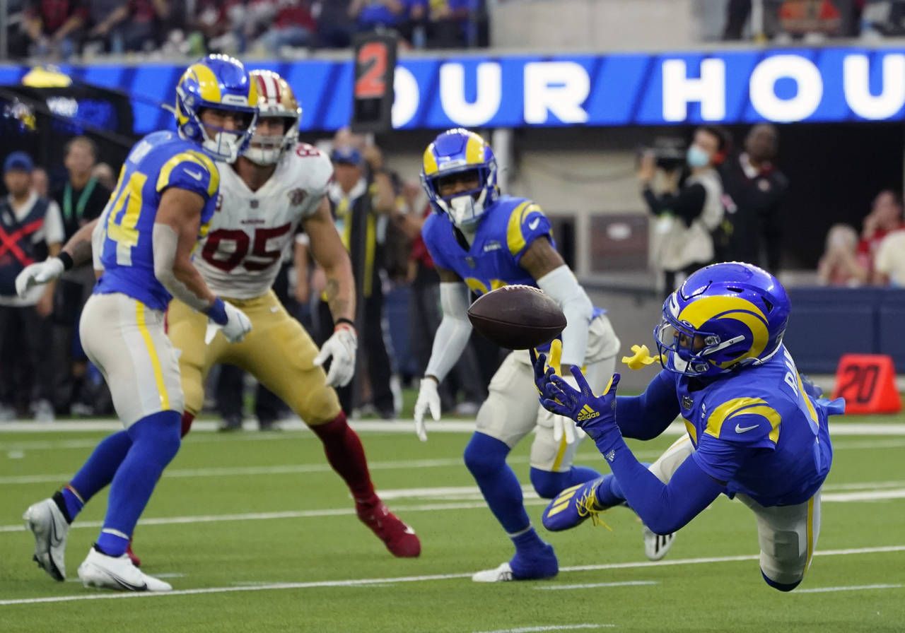 FILE - Los Angeles Rams cornerback Jalen Ramsey, right, intercepts a pass during the second half of...