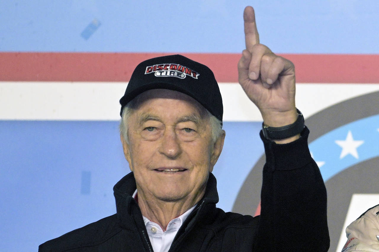FILE - Car owner Roger Penske gestures in Victory Lane after Austin Cindric won the NASCAR Daytona ...