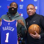 
              Philadelphia 76ers' James Harden, left, poses with head coach Doc Rivers after taking questions from the media at a press conference at the NBA basketball team's facility, Tuesday, Feb. 15, 2022, in Camden, N.J. (AP Photo/Chris Szagola)
            