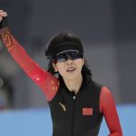 
              Ahenaer Adake of China reacts after finishing her heat in the women's speedskating 1,500-meter race at the 2022 Winter Olympics, Monday, Feb. 7, 2022, in Beijing. (AP Photo/Sue Ogrocki)
            