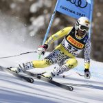 
              FILE - Kenya's Sabrina Simader speeds down the course during the women's super-G, at the alpine ski World Championships, in Cortina d'Ampezzo, Italy, Thursday, Feb. 11, 2021. Seba Johnson broke barriers during the 1988 Calgary Games, becoming the first Black woman to ski in a Winter Games, and at 14, the youngest. The next Black woman in an Olympic Alpine ski was Simader who skied in the 2018 Games at Pyeongchang, South Korea. (AP Photo/Marco Trovati, File)
            