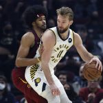 
              Indiana Pacers' Domantas Sabonis (11) plays against Cleveland Cavaliers' Jarrett Allen, left, during the first half of an NBA basketball game, Sunday, Feb 6, 2022, in Cleveland. (AP Photo/Ron Schwane)
            