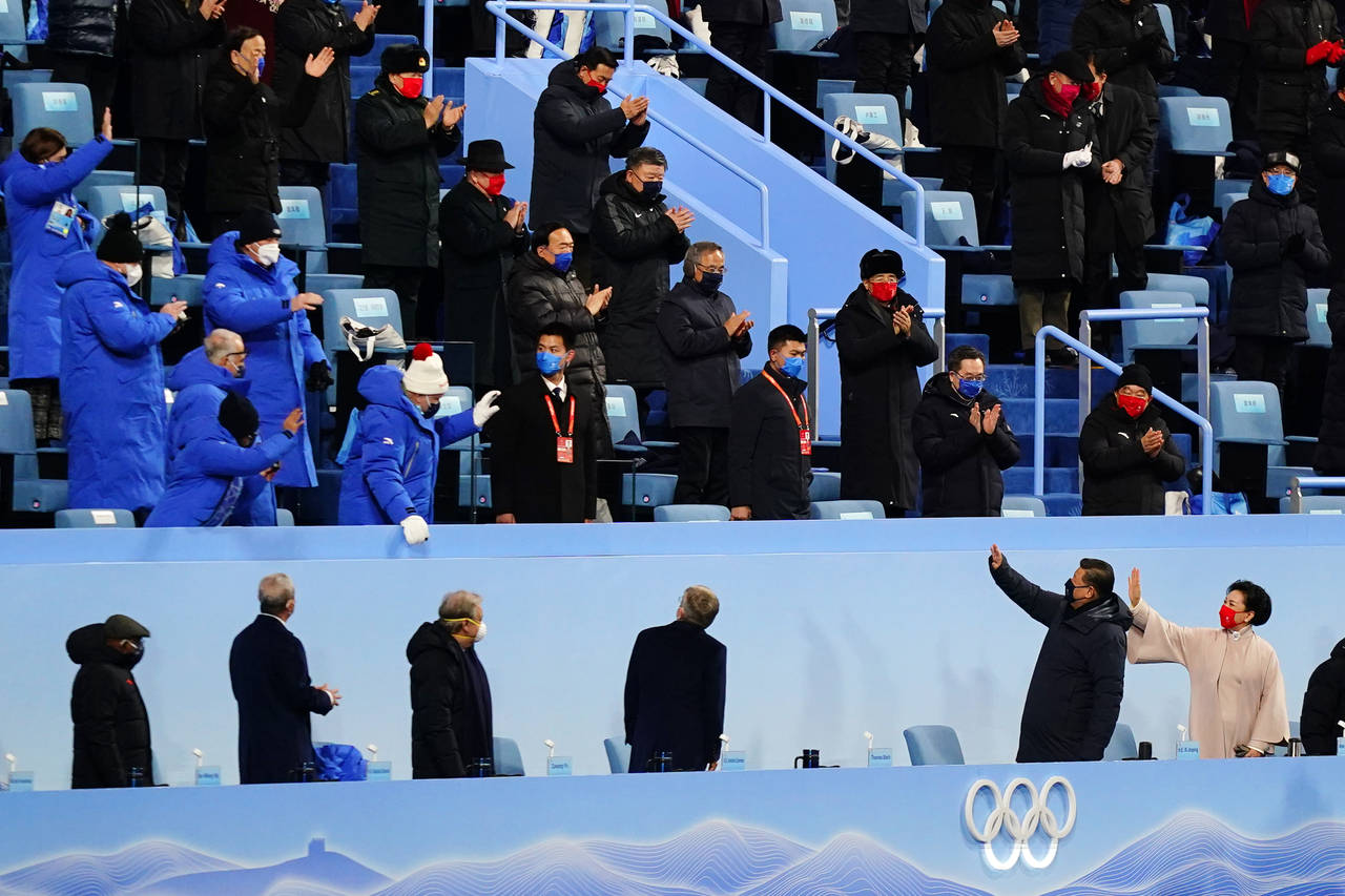 Chinese President Xi Jinping, bottom second from right, waves as he arrives for the opening ceremon...