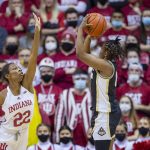 
              Indiana guard Chloe Moore-McNeil (22) attempts to block a shot by Purdue guard Brooke Moore (0) during the second half of an NCAA college basketball game, Sunday, Feb. 6, 2022, in Bloomington, Ind. (AP Photo/Doug McSchooler)
            