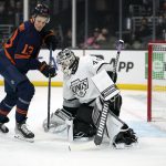 
              A shot by Edmonton Oilers right wing Jesse Puljujarvi, center, is deflected by Los Angeles Kings goaltender Cal Petersen, right, during the first period of an NHL hockey game Tuesday, Feb. 15, 2022, in Los Angeles. (AP Photo/Mark J. Terrill)
            