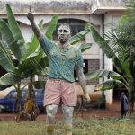 
              The Statue of late Cameroonian soccer star Marc-Vivien Foé stands outside his abandoned soccer academy in Yaounde, Cameroon, Wednesday Feb. 2, 2022. The late Cameroon and Manchester City soccer star Marc-Vivien Foé had a dream to build a sports complex and school in his hometown of Yaounde. He never got to finish it after collapsing on a field while playing for his country in 2003 and dying of a heart condition at the age of 28. (AP Photo/Sunday Alamba)
            